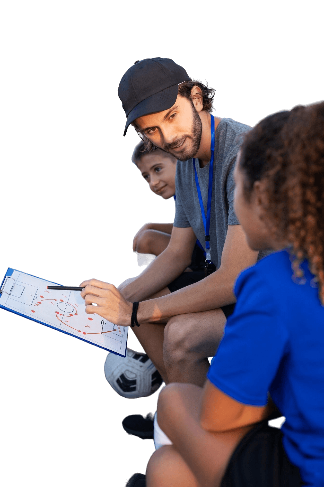 Coach reviewing a play with two young athletes