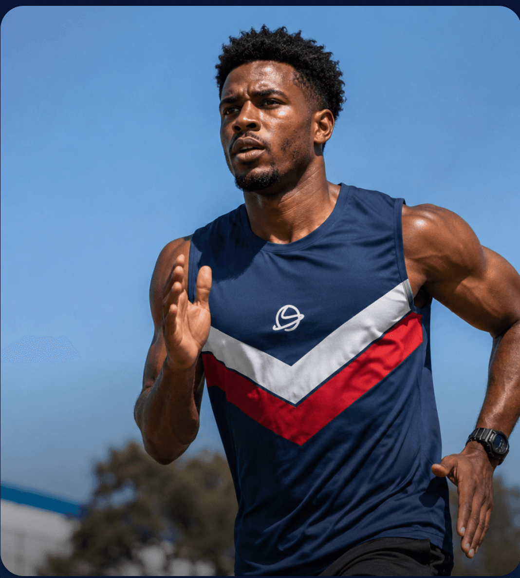 Sprinter mid-stride in a track uniform